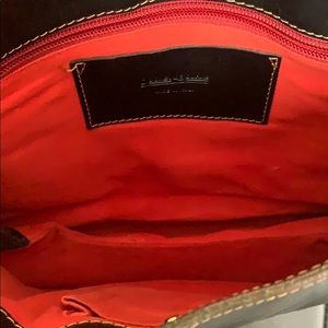 Dooney & Burke black leather with rich red